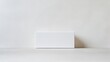 © Svfotoroom - Front view of a clean, white paper box packaging without labels or logos against a plain white background, ideal for design purposes