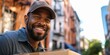 © LukaszDesign - Courier service worker with a box for distribution and logistics in an outdoor portrait. E-commerce, cardboard packaging, and a smiling delivery worker