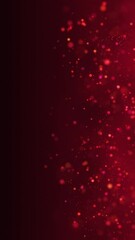 Poster - Red glowing circles particles dust flying at the middle right on a dark abstract background, bokeh effect, vertical composition. Loop animation footage for graphic design.