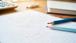 © LunaStar - Study materials on graph paper with pencils and calculator, learning concepts