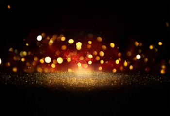 Poster - Glowing gold and red bokeh lights sparkle on a dark background, creating a magical, festive atmosphere.  The glittering effect suggests a celebratory mood.