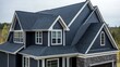 © AGUNG - Dark gray shingle roof on a luxury house.