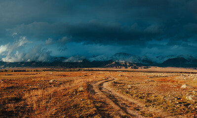 Wall Mural - Picturesque landscape with snowy high mountains in autumn, dramatic weather