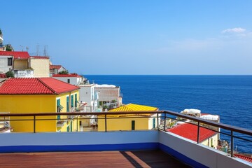 Poster - A balcony with a view of the ocean, perfect for relaxation or taking in the sunset