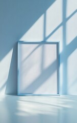 Poster - Serenity in a Minimalist Space With Soft Blue Shadows and an Empty Frame Inviting Creativity