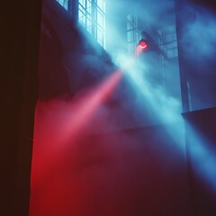 Poster - Colorful Light Beams Illuminate a Misty Industrial Space With Red and Blue Hues Creating a Dramatic Atmosphere in an Urban Setting