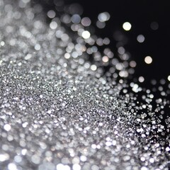Poster - Sparkling Silver Glitter Shines Against a Dark Background, Creating a Mesmerizing Effect Ideal for Various Creative Projects and Celebrations