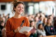 © Lens Legacy - Bright smile of a young speaker engaging an audience during a lively event in a modern conference hall