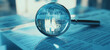 © Aziz - Magnifying glass placed on financial documents with charts and graphs, highlighting data analysis