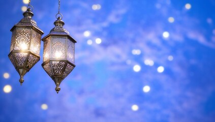 Poster - Two ornate lanterns glowing against a soft blue background.