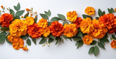 Wall Mural - Vibrant Floral Arrangement of Orange and Yellow Marigold Flowers Intertwined with Green Leaves on a Soft White Background