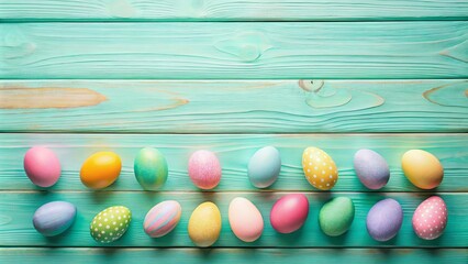 Wall Mural - Pastel Easter eggs arranged on a teal wood background