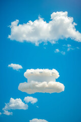 Wall Mural - fluffy white cloud platform a vivid blue sky