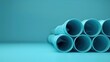 © Waraporn - Stacked blue steel pipes in an industrial construction concept showcasing the minimalist architectural design and engineering of pipework infrastructure