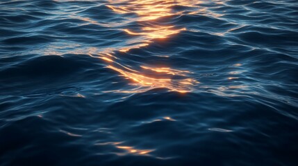 Poster - Golden sunset reflecting on dark blue ocean water with gentle waves.