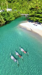 Poster - Soft waves gently caress the shore while people unwind in hammocks suspended over clear turquoise waters. The serene beach setting of Koh Kood Thailand invites total relaxation and blissful moments.