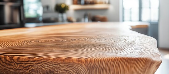 Poster - Rustic wood countertop showcasing intricate grain patterns in a softly blurred minimalist kitchen setting for interior design inspiration