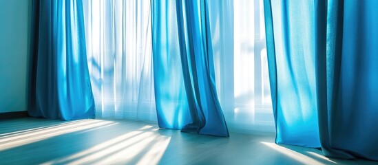 Poster - Elegant sheer blue curtains gracefully swaying in soft natural light complementing modern indoor decor aesthetics