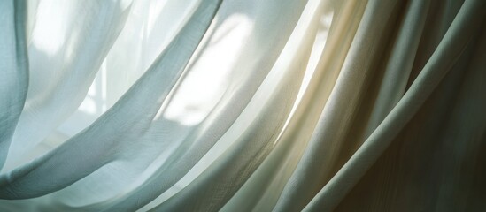 Poster - Soft sheer curtain fabric flowing gently at a window ideal for creating a serene and elegant interior design atmosphere.