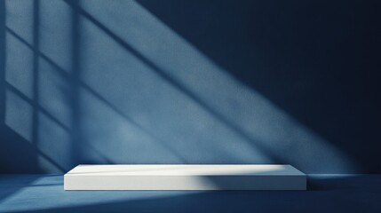 Poster - Minimalistic display platform casting shadows in natural light on a dark blue background ideal for showcasing product advertisements.