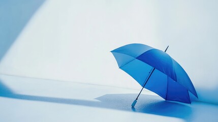 Poster - Blue umbrella on a white background with geometric light leaks creating a serene and modern aesthetic for creative design projects