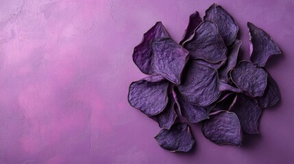 Crispy purple sweet potato chips arranged on a vibrant purple background suitable for healthy snack concepts and culinary presentations