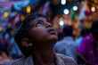 © Indian People Images - Against the backdrop of a bustling marketplace, an Indian boy's chest tightens with anxiety, his breaths shallow and uneven, as he struggles to overcome his fear of crowds.