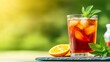 © Albert - A glass of iced tea with a slice of orange next to it