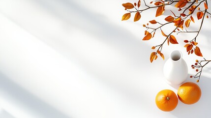 Wall Mural - A white vase sitting next to two oranges on a table