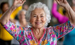 © bborriss - Happy senior woman exercising with arms raised in gym class