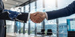 © Shayan  - Smart logistics, Global business concept. Businessman making handshake for successful business, investment deal teamwork and partnership business partners on logistic global network and supply chain