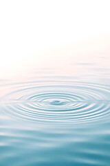 Wall Mural - Close-up of gentle ripples on a calm water surface, creating a soothing and serene pattern. Wellness, cosmetics, and eco-friendly advertising banners.