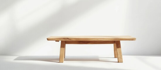 Poster - Minimalist low wooden table with natural finish on white background perfect for interior design and minimalistic decor presentations