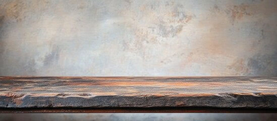 Poster - Weathered wooden tabletop with grunge finish against softly blurred interior ideal for product display and culinary photography