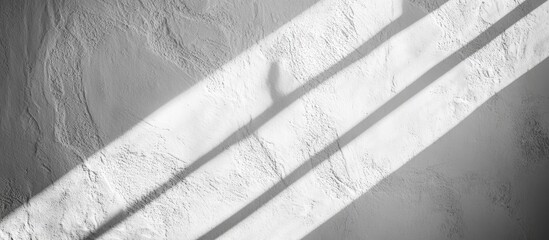 Poster - Interplay of light and shadow on a textured white wall creating a dynamic background for promotional or artistic use
