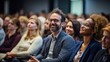 © Boomanoid - Man smiling in front of audience