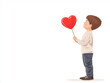 © Leninya - boy holding red heart shaped lollipop looks up with joy and wonder. This charming scene captures innocence and affection, perfect for conveying love and happiness