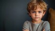 © btiger - Angry Boy with Crossed Arms Upset Expression Young Male Child Frustrated Toddler Portrait