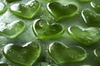 © DaniLana - Matcha tea with floating heart-shaped ice chunks on the surface of the tea