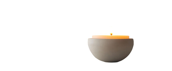 Aufkleber - A simple, elegant candle in a bowl, emitting a warm glow for ambiance.