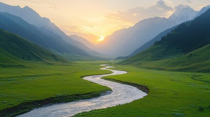 Wall Mural - River flows through green valley with sun setting behind mountains.