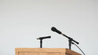 © Ehtasham - a microphone is sitting at a podium with a microphone in front of it and a microphone in the background, Antonie Palamedesz, institutional critique, behance hd, a stock photo