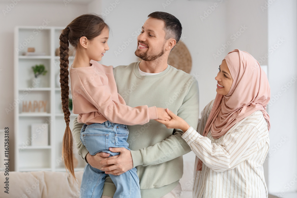 Muslim parents with their daughter at home