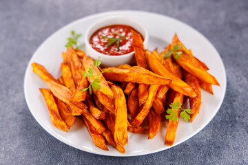 Wall Mural - fried sweet potatoes with spicy sauce