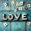 © Johannes - Word love, heart and flowers on turquoise painted wooden background. Selective focus.