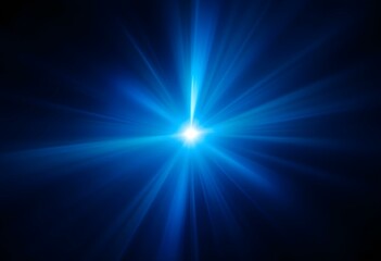 Poster - Bright blue light burst with radial rays on dark background. Glowing star effect with lens flare. Abstract cosmic energy background for spiritual, space and science designs
