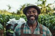 © LifeMedia - Smiling farmer in traditional attire amidst lush green crops during a sunny day