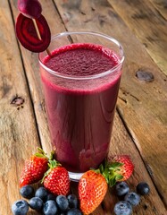 Wall Mural - Beetroot and berry boost juice sitting on rustic wooden table