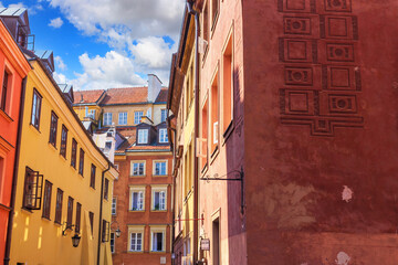 Wall Mural - Cityscape - view of narrow streets with colorful old houses in the Old Town of Warsaw, Poland