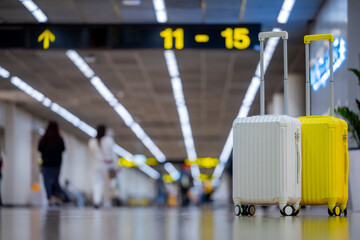 Fototapete - Two suitcases in an empty airport hall, traveler cases in the departure airport terminal waiting for the area, vacation concept, blank space for text message or design, travel.